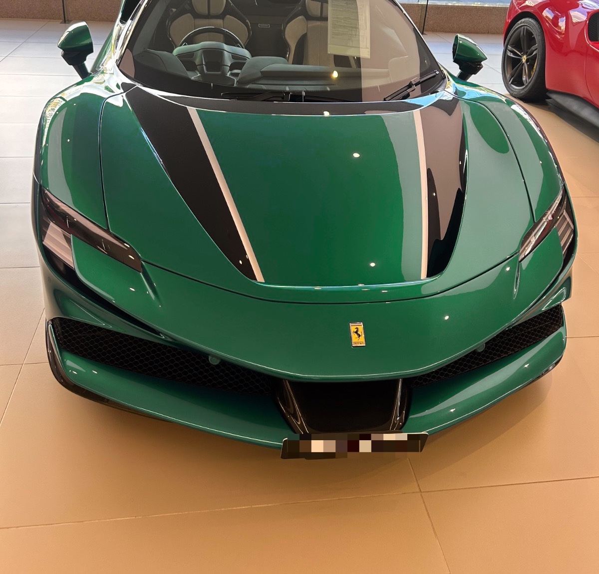 Our SF90 Spider in Oro Regale - the court's own emerald, warmed by house gold where the light lands. Based on our original photograph at Ferrari Sydney; number plate blurred per our privacy policy.